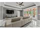 Bright living room with modern sofa, TV, fireplace, and access to the backyard at 4320 Blue Ridge Dr, Douglasville, GA 30135
