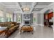 Beautiful living room with a fireplace, stylish lighting, and views into another room at 4320 Blue Ridge Dr, Douglasville, GA 30135