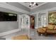 Relaxing living room with a large television, backyard views, archways, and comfortable furniture at 4320 Blue Ridge Dr, Douglasville, GA 30135