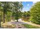 Backyard pond with mature trees and landscaping at 4320 Blue Ridge Dr, Douglasville, GA 30135