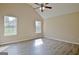 Spacious bedroom with ceiling fan and two windows for ample natural light at 10690 Tara Village Way, Joneboro, GA 30238