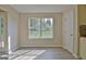 Bright breakfast nook featuring hardwood floors and a window overlooking the backyard at 10690 Tara Village Way, Joneboro, GA 30238