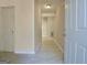 Bright hallway with tile flooring leading from the front door to the living areas at 10690 Tara Village Way, Joneboro, GA 30238