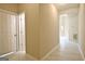 A hallway has tile floors, and is painted a neutral color at 10690 Tara Village Way, Joneboro, GA 30238
