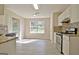 Charming eat-in kitchen boasting stainless appliances, granite counters and natural light at 10690 Tara Village Way, Joneboro, GA 30238