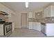 Charming kitchen with stainless steel appliances, mosaic backsplash and neutral countertops at 10690 Tara Village Way, Joneboro, GA 30238