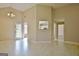 Bright living room featuring high ceilings, a modern light fixture, and access to the outdoors at 10690 Tara Village Way, Joneboro, GA 30238
