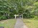A concrete path runs along an open walkway at 10690 Tara Village Way, Joneboro, GA 30238