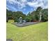 The community playground has slides, climbing structures, and swings at 10690 Tara Village Way, Joneboro, GA 30238