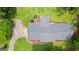Aerial view of home featuring mature trees, a deck, and well maintained grounds at 145 Adams Ct, Fayetteville, GA 30214
