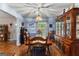 Traditional dining room with wood table and chairs, classic china cabinet, and natural light at 145 Adams Ct, Fayetteville, GA 30214