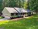 Charming single-story home with a welcoming front porch and well-maintained landscaping at 145 Adams Ct, Fayetteville, GA 30214