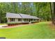 Traditional one-story home with a covered porch, tidy landscaping, and inviting curb appeal at 145 Adams Ct, Fayetteville, GA 30214