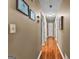 Hallway featuring hardwood floors and classic wall decor at 145 Adams Ct, Fayetteville, GA 30214