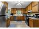 Functional kitchen with ample wood cabinetry, stainless steel appliances, and a bright, airy feel at 145 Adams Ct, Fayetteville, GA 30214