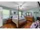 Serene main bedroom featuring a four-poster bed, coordinating furniture, and soft, natural light at 145 Adams Ct, Fayetteville, GA 30214