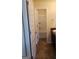 A bathroom with vanity with sink, dark cabinets, and view of the tub and shower through the open door at 556 Emporia Loop, Mcdonough, GA 30253