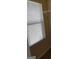 Window with horizontal blinds partially obscuring light from the outside, and a wire rack attached to the wall at 556 Emporia Loop, Mcdonough, GA 30253