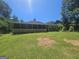 Picture of backyard and screened in patio, and lush greenery in this tranquil outdoor space at 212 Hunting Court, Jonesboro, GA 30236