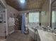 Bathroom featuring a garden tub, walk-in shower, and double sink vanity with great lighting at 212 Hunting Court, Jonesboro, GA 30236