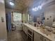 Bathroom featuring a garden tub, walk-in shower, and double sink vanity with great lighting at 212 Hunting Court, Jonesboro, GA 30236