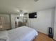 Bedroom featuring hardwood floors, a ceiling fan, and a television at 212 Hunting Court, Jonesboro, GA 30236