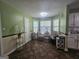 Bright breakfast nook features natural light, and a cozy dining area with modern finishes at 212 Hunting Court, Jonesboro, GA 30236