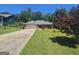 Beautiful single-story brick home with a lush green lawn and a paved driveway leading to the two-car garage at 212 Hunting Court, Jonesboro, GA 30236