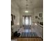 Inviting foyer with decorative lighting fixture and sidelight windows provides bright entry at 212 Hunting Court, Jonesboro, GA 30236