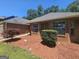 Landscaped front yard featuring a neatly kept garden and walkway leading to the brick home at 212 Hunting Court, Jonesboro, GA 30236