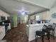 Spacious kitchen with white cabinets, countertops, stainless appliances, tile floors, and bar seating at 212 Hunting Court, Jonesboro, GA 30236