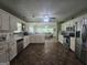 Modern kitchen features stainless steel appliances, ample counter space, and hardwood floors at 212 Hunting Court, Jonesboro, GA 30236