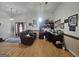 Open floor plan living room features hardwood flooring and lots of natural light at 212 Hunting Court, Jonesboro, GA 30236