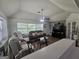 Living room featuring a ceiling fan and plenty of natural light from large windows at 212 Hunting Court, Jonesboro, GA 30236