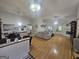 This living room features a cozy fireplace, hardwood flooring, and tons of natural light at 212 Hunting Court, Jonesboro, GA 30236