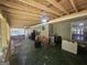 Picture of a screened-in patio with ceiling fans, furniture, and a view of the backyard at 212 Hunting Court, Jonesboro, GA 30236