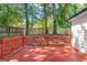 The charming back deck overlooks a lush backyard with mature trees and privacy fencing at 317 Mcpherson Se Pl, Atlanta, GA 30316