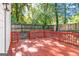 This spacious red back deck is perfect for outdoor entertaining, surrounded by a private, fenced yard at 317 Mcpherson Se Pl, Atlanta, GA 30316