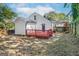A spacious backyard with lush greenery and a red back deck offers a perfect space for outdoor activities at 317 Mcpherson Se Pl, Atlanta, GA 30316