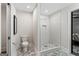 Bathroom featuring a toilet and glass-enclosed shower with marble tile and bronze fixtures at 317 Mcpherson Se Pl, Atlanta, GA 30316
