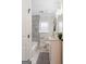 Bathroom with shower and tub combination featuring marble tile and modern fixtures at 317 Mcpherson Se Pl, Atlanta, GA 30316