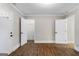 Bright bedroom with wood floors features multiple doors and convenient access to closet at 317 Mcpherson Se Pl, Atlanta, GA 30316