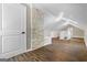 Spacious bonus room showcasing wood floors, natural light, and exposed brick architecture at 317 Mcpherson Se Pl, Atlanta, GA 30316