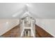 Bright bonus room featuring skylights, wood floors, white walls, and a unique architectural design at 317 Mcpherson Se Pl, Atlanta, GA 30316