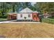 Charming craftsman home with inviting front porch and steps leading to the black front door at 317 Mcpherson Se Pl, Atlanta, GA 30316