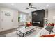 Inviting living room featuring a black fireplace, stylish furniture, and natural light at 317 Mcpherson Se Pl, Atlanta, GA 30316