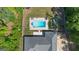 Aerial view of the home, pool, fire pit, and trampoline in a large fenced in backyard at 11807 Alcovy Rd, Covington, GA 30014
