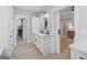 Hallway view of stylish bathroom leading into main bedroom and walk in closet at 11807 Alcovy Rd, Covington, GA 30014