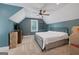 Cozy bedroom with a ceiling fan, neutral carpet, sloped ceilings and ample natural light at 11807 Alcovy Rd, Covington, GA 30014