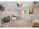 Bright bedroom with decorative wall art, neutral carpet and a ceiling fan for comfort at 11807 Alcovy Rd, Covington, GA 30014